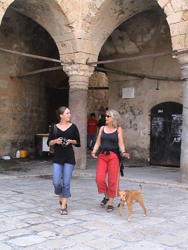 khan el Umdan -caravanserail Akko 2009 with Clotilde and Sol my dog